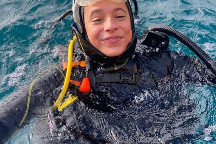 MC Pedrinho swimming in a body of water