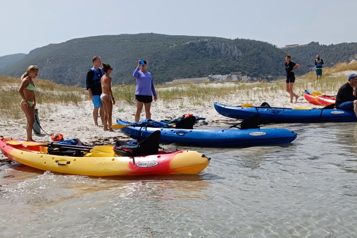 a group of people on a boat in the water