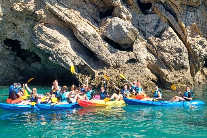 a group of people on a boat in the water