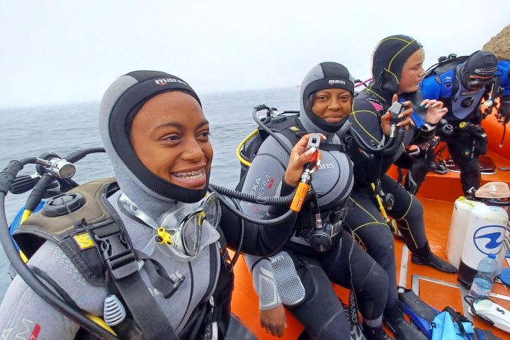 a group of people on a motorcycle