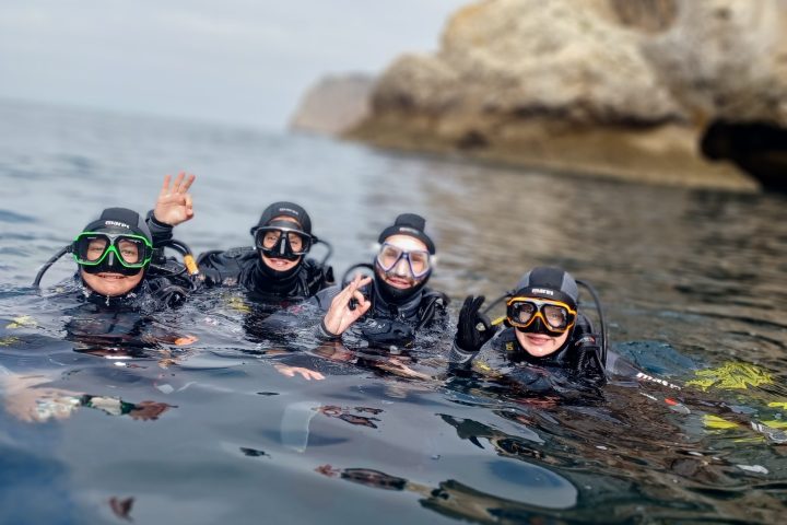 a group of people swimming in the water