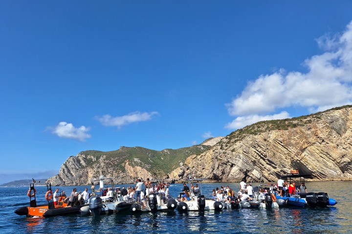 a group of people in a boat on a body of water