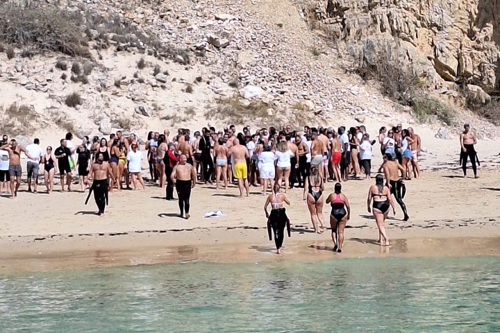 a group of people on a beach