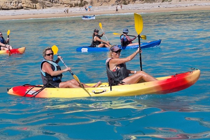 a group of people on a boat in the water