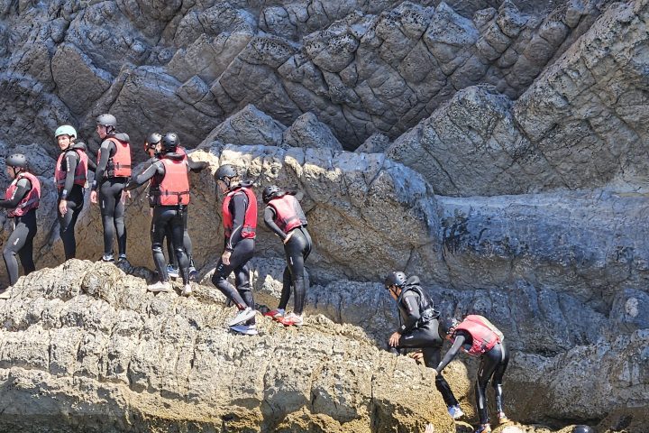 a group of people on a rock