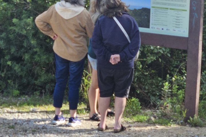 a couple of people that are standing in the dirt