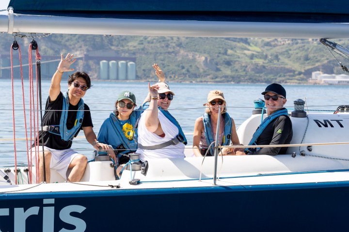 a group of people on a boat in the water