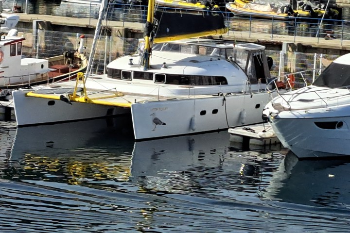 a boat is docked next to a body of water