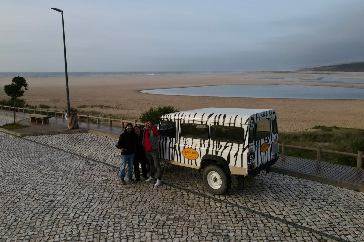 a group of people riding on the back of a truck