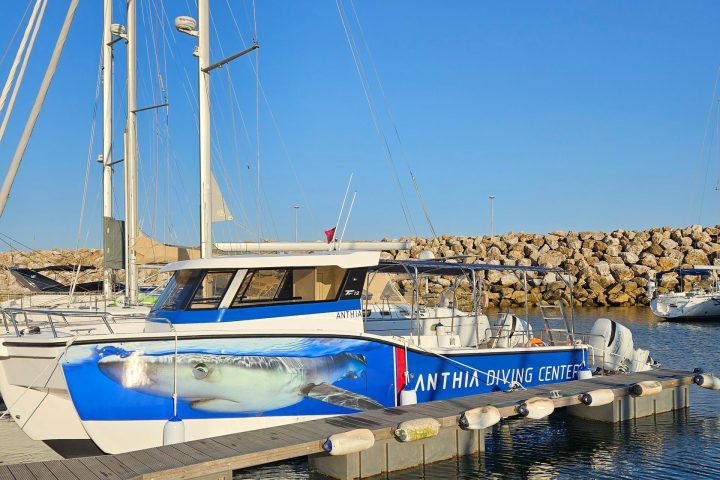 a boat is docked next to a body of water