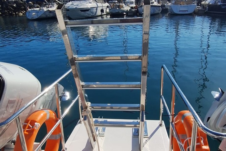 a boat is docked next to a body of water
