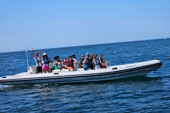 a group of people on a boat in the water