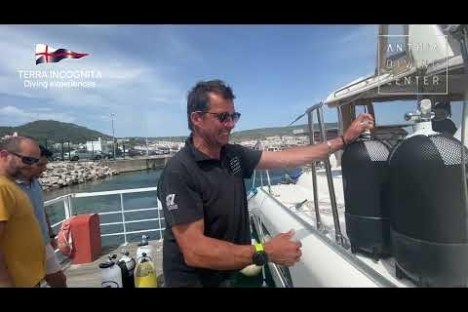 a man standing next to a boat