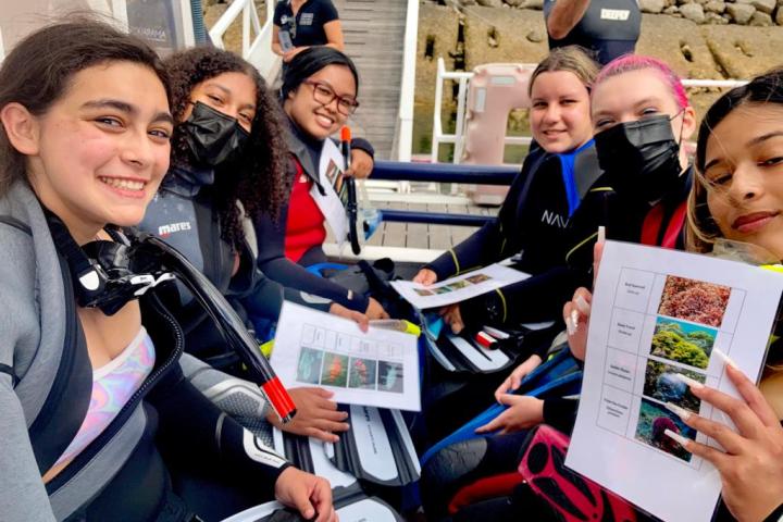 a group of people around each other