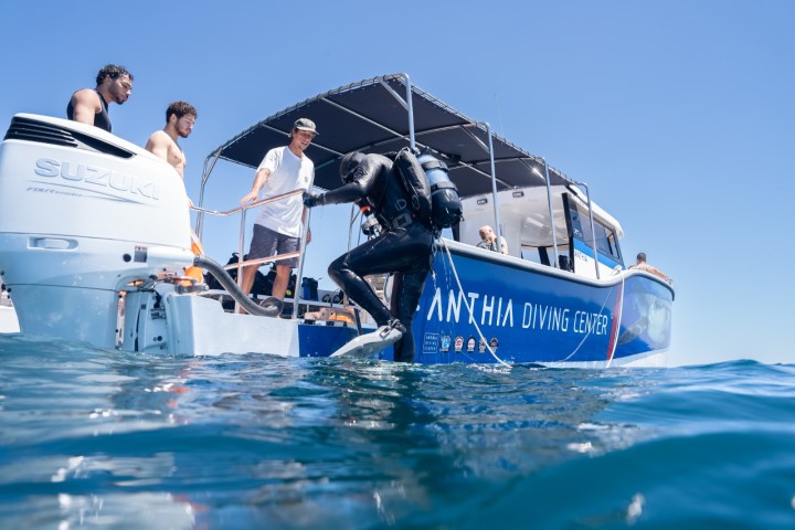 a group of people riding on the back of a boat