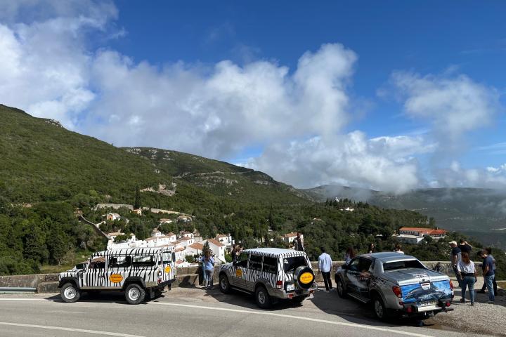 a car parked on the side of a mountain road