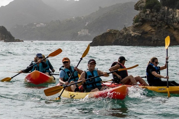 a group of people on a boat in the water