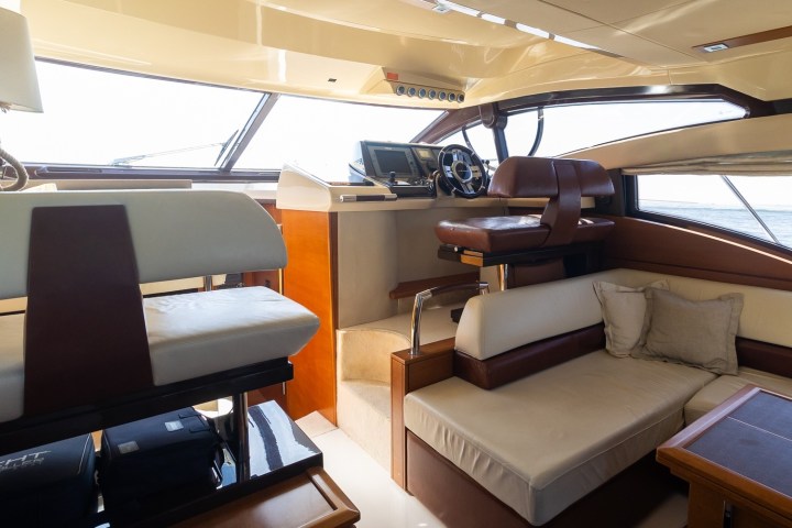 a bedroom with a bed and desk in a room