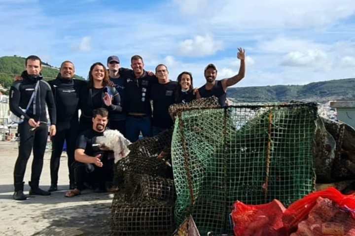 a group of people sitting at a beach