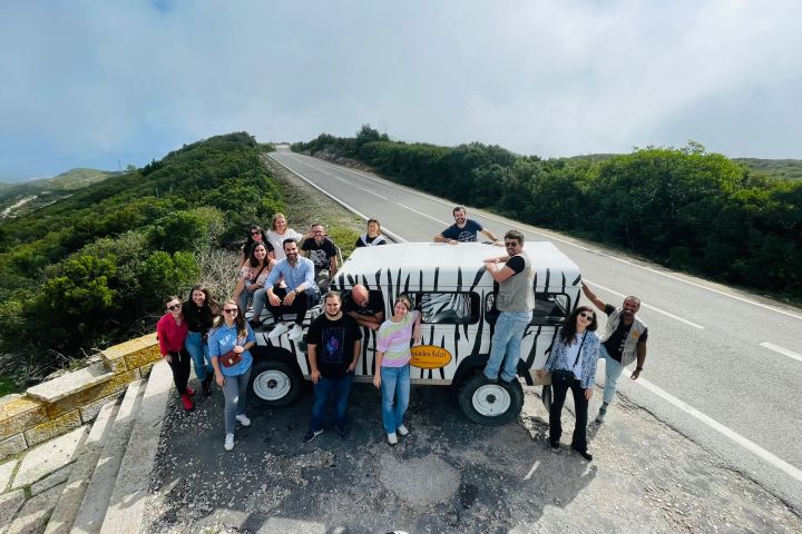 a group of people on a mountain road