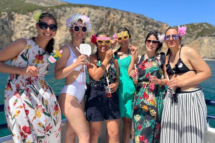 a group of people standing in front of a crowd posing for the camera